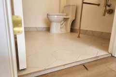 A clean bathroom featuring hexagon tile flooring installed by Grapme Tile Works, showcasing quality craftsmanship in tile installation.