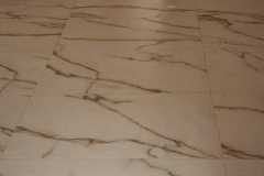 Beautiful marble flooring with natural veining enhances interior elegance and style.