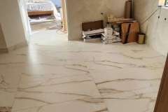 Luxurious marble tile flooring enhances the aesthetic of this contemporary home interior.