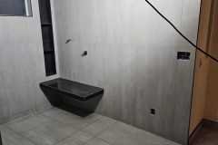 Showcasing sleek, contemporary tile work in a bathroom renovation project.