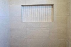 Custom tiled shower niche for modern bathroom interiors.