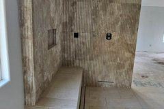 Contemporary tile wall design with textured surface, showcasing craftsmanship at GRAPME TILE WORKS CORP.