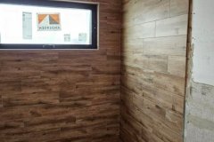 Modern interior wall featuring wood tiles installed by Grapme Tile Works Corp.