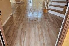 Style tile flooring enhances the aesthetic of this bright, modern home interior, providing durability and style.