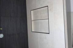 Contemporary tile wall featuring a built-in niche, ideal for decor or storage in modern interiors.